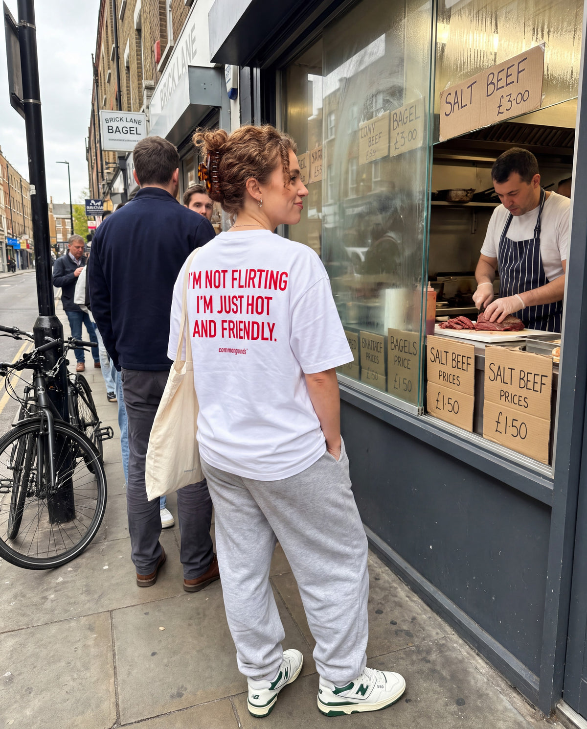 I'M NOT FLIRTING I'M JUST HOT AND FRIENDLY. Tee in white, worn