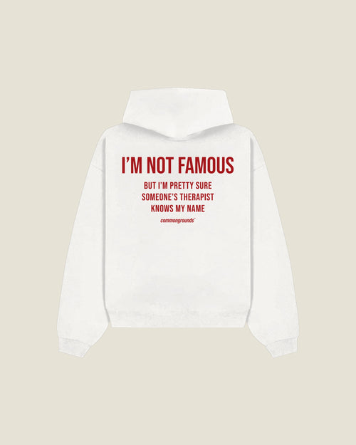 I'M NOT FAMOUS BUT I'M PRETTY SURE SOMEONE'S THERAPIST KNOWS MY NAME Hoodie in white, back print