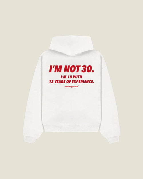 I'M NOT 30. I'M 18 WITH 12 YEARS OF EXPERIENCE Hoodie in white, back print