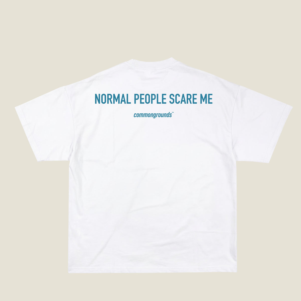 NORMAL PEOPLE SCARE ME Tee in white, back print