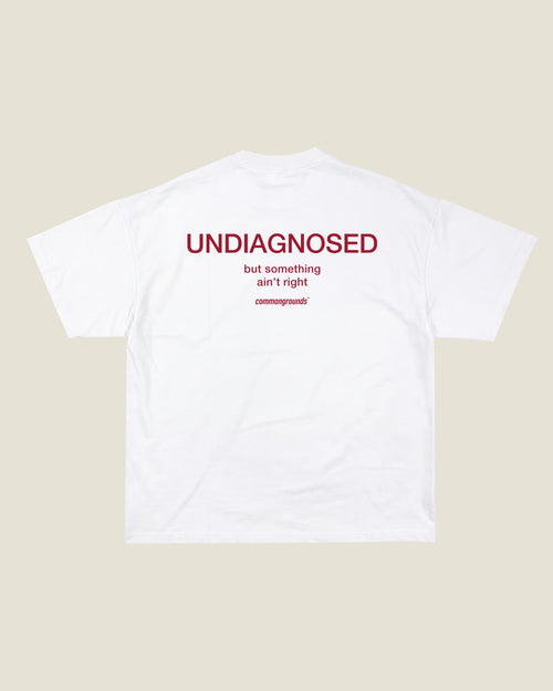 UNDIAGNOSED BUT SOMETHING AIN'T RIGHT Tee in white, back print