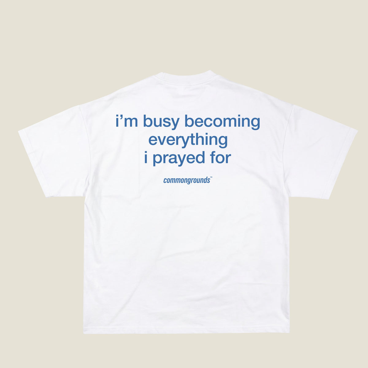 I'M BUSY BECOMING EVERYTHING I PRAYED FOR Tee in white, back print