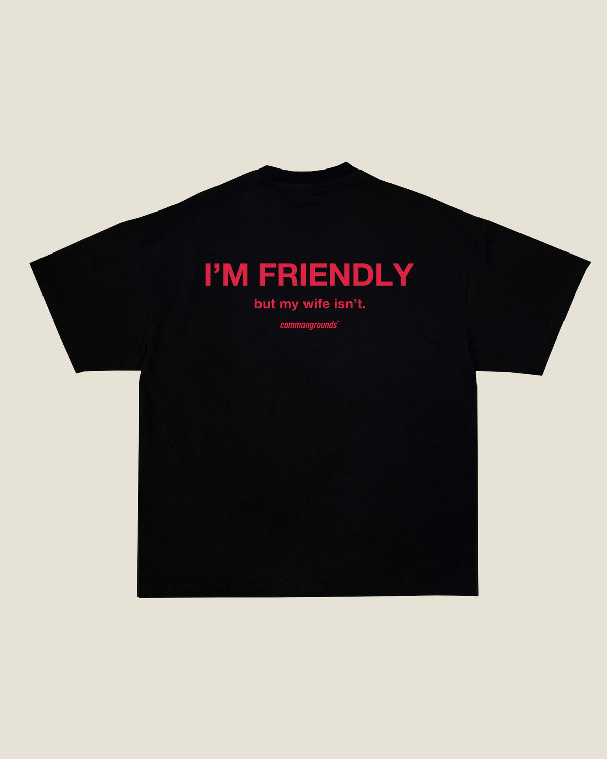 I'M FRIENDLY, BUT MY WIFE ISN'T Tee in black, back print