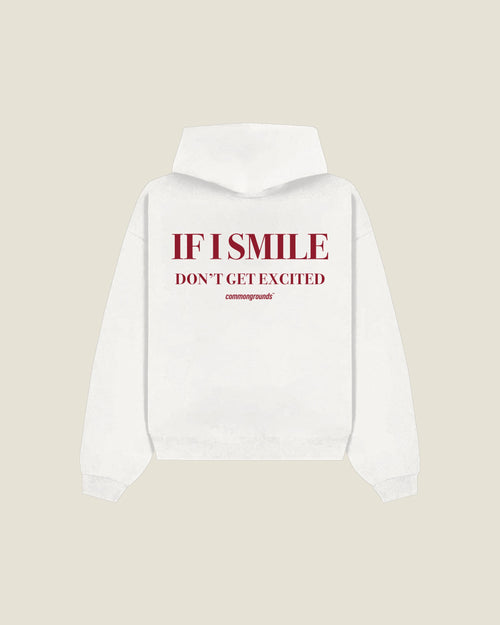 If I Smile Don't Get Excited Hoodie in white, back print