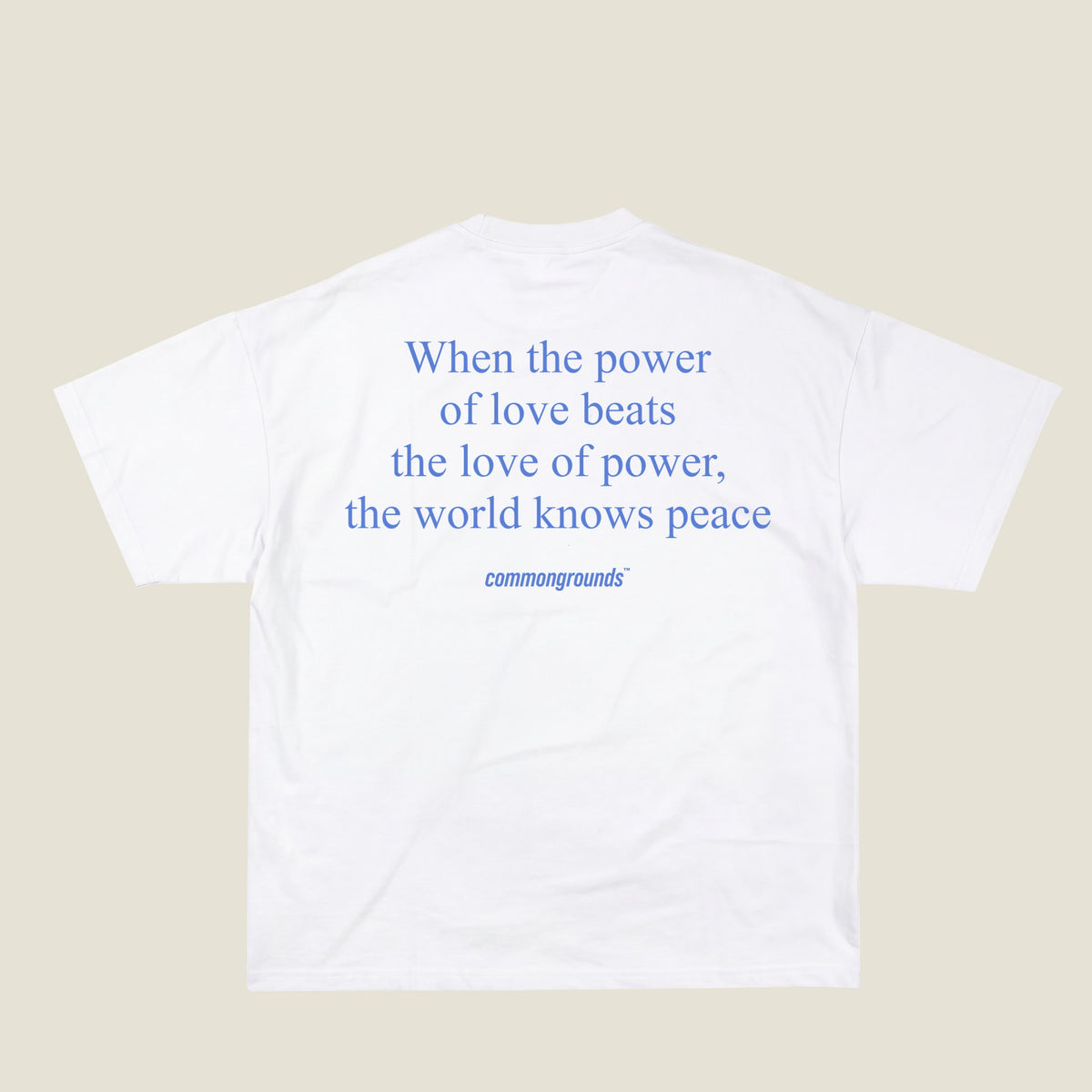 WHEN THE POWER OF LOVE BEATS THE LOVE OF POWER, THE WORLD KNOWS PEACE Tee in white, back print