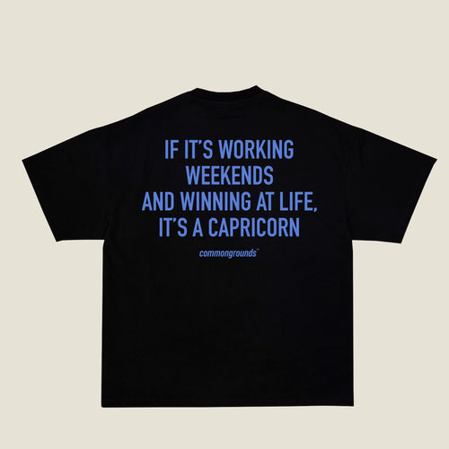 IF IT'S WORKING WEEKENDS AND WINNING AT LIFE, IT'S A CAPRICORN Tee in black, back print