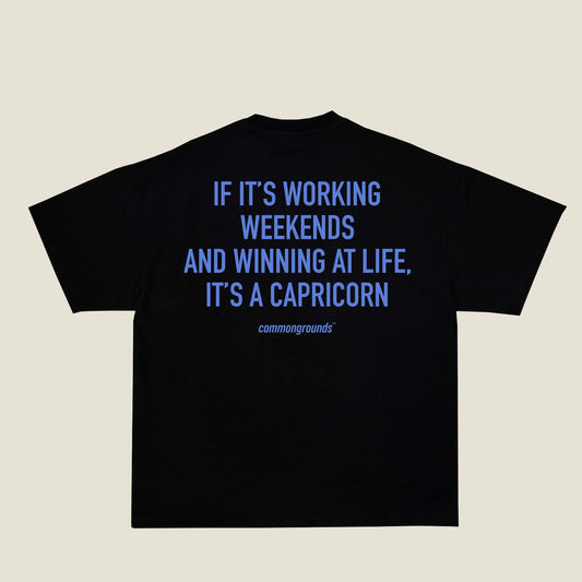 IF IT'S WORKING WEEKENDS AND WINNING AT LIFE, IT'S A CAPRICORN Tee in black, back print
