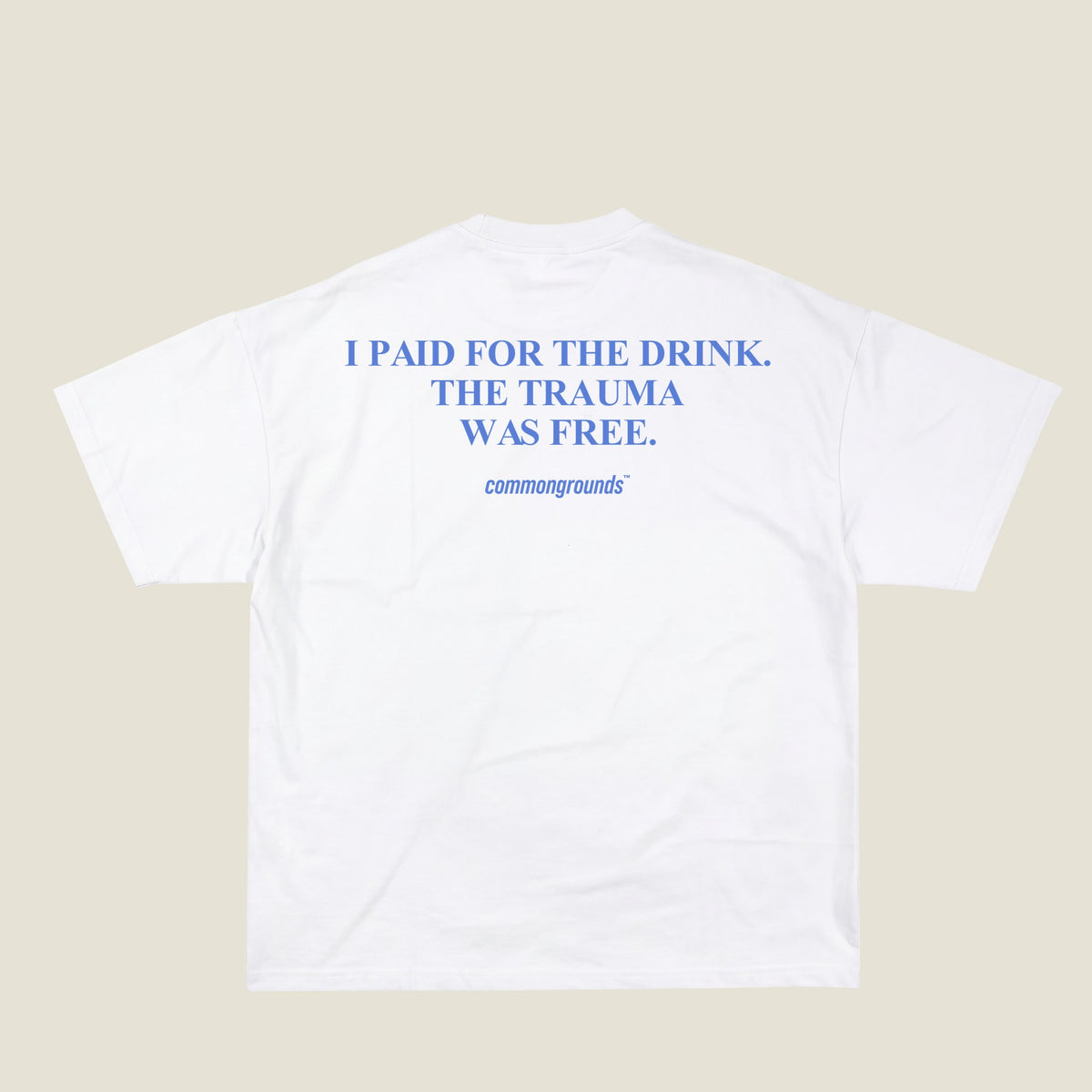 I PAID FOR THE DRINK. THE TRAUMA WAS FREE Tee in white, back print