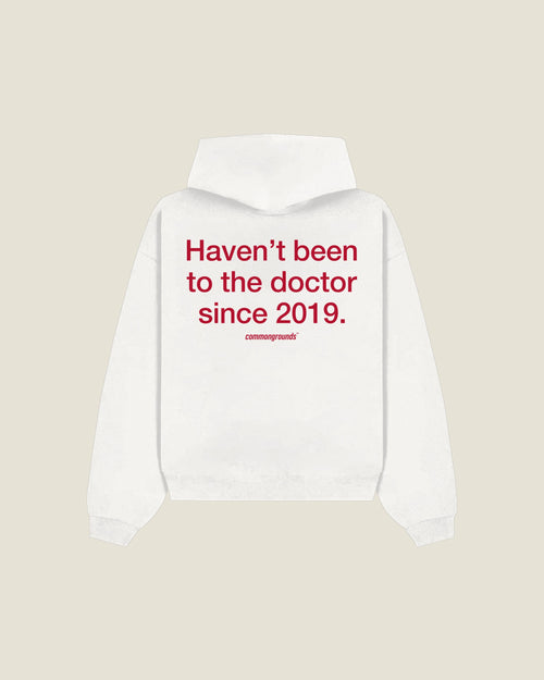 Haven't Been To The Doctor Since 2019 Hoodie in white, back print