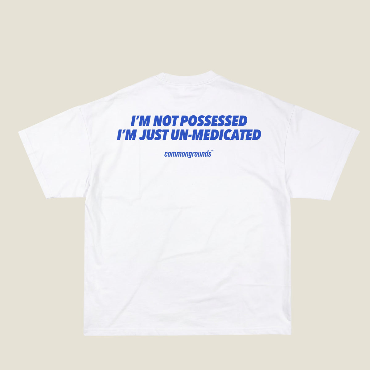I'M NOT POSSESSED I'M JUST UN-MEDICATED Tee in white, back print