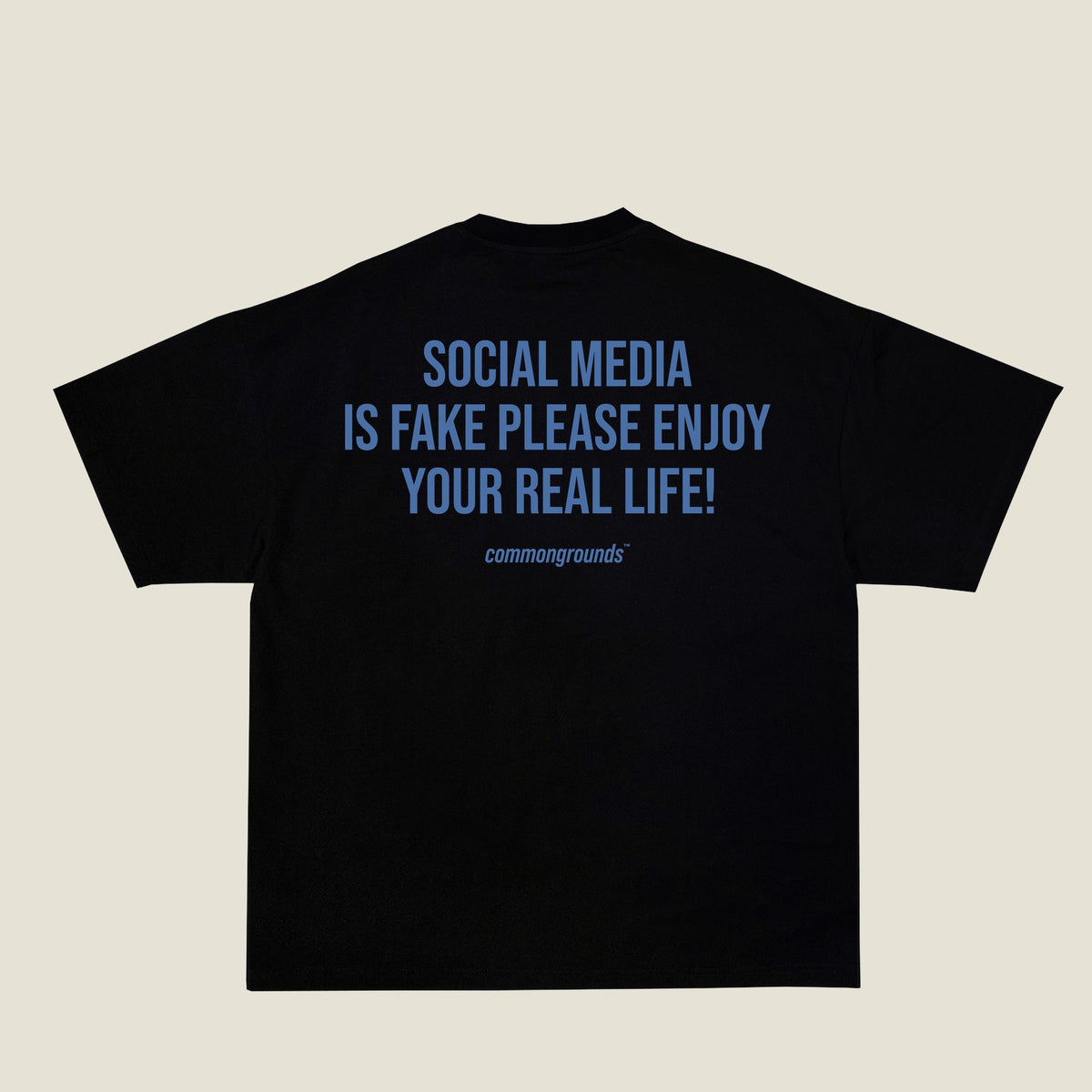 SOCIAL MEDIA IS FAKE PLEASE ENJOY YOUR REAL LIFE Tee in black, back print