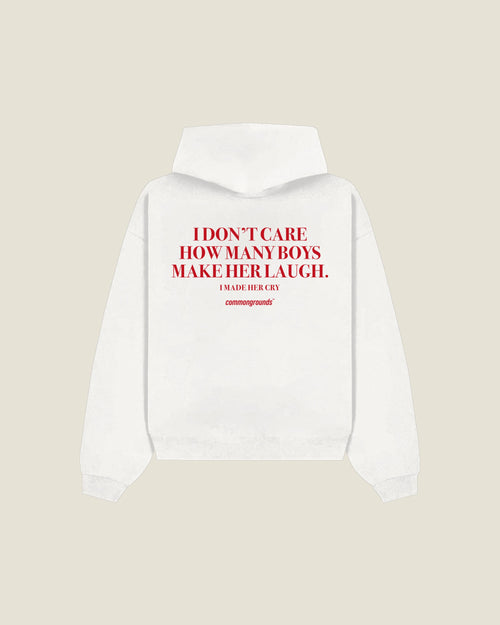 I Don't Care How Many Boys Make Her Laugh. I Made Her Cry Hoodie in white, back print