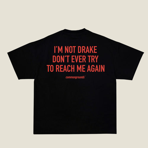 I'M NOT DRAKE DON'T EVER TRY TO REACH ME AGAIN Tee in black, back print