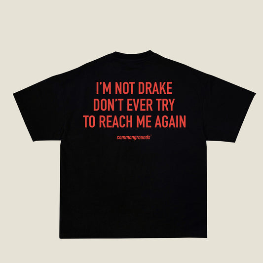 I'M NOT DRAKE DON'T EVER TRY TO REACH ME AGAIN Tee in black, back print