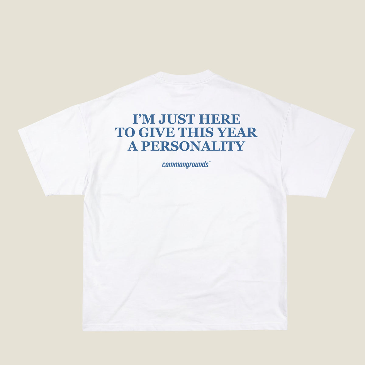 I'M JUST HERE TO GIVE THIS YEAR A PERSONALITY Tee in white, back print
