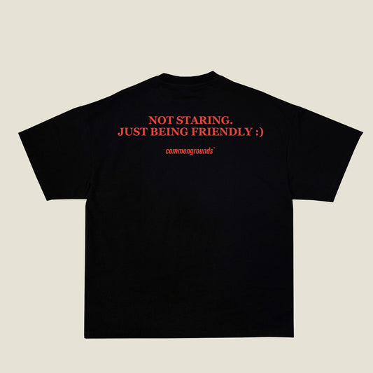 NOT STARING. JUST BEING FRIENDLY :) Tee in black, back print