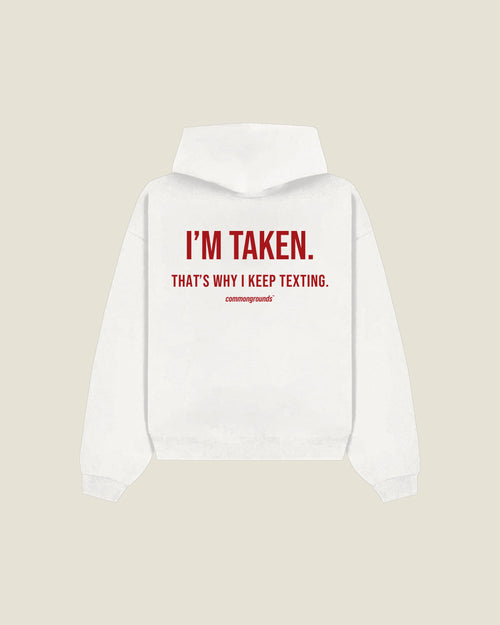 I'm Taken. That's Why I Keep Texting Hoodie in white, back print