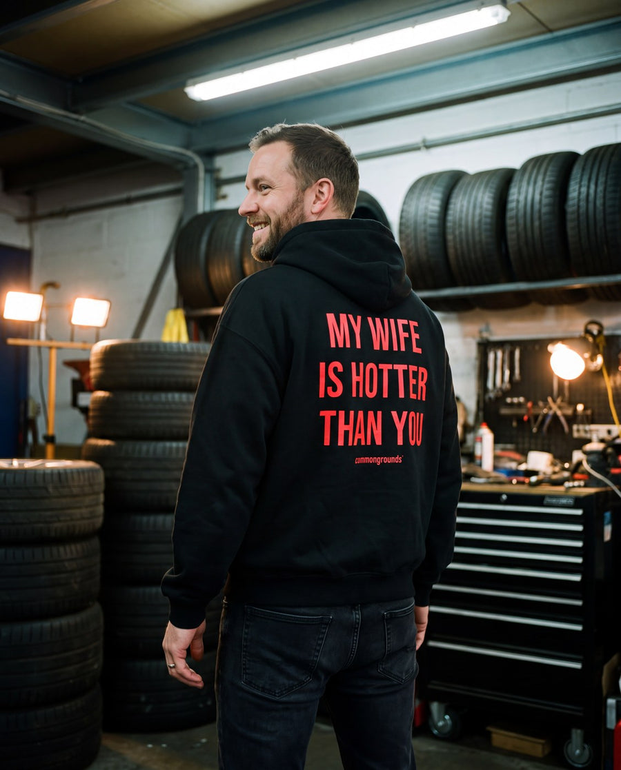 Man in a Common Grounds hoodie in a garage